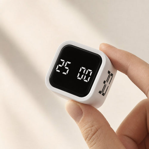 Fingertips holding the white FlipTimer mid-flip, display showing 25 minutes